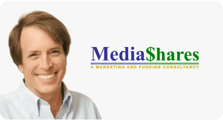 Woman from MediaShares smiling at the results of their ZeroBounce case study.